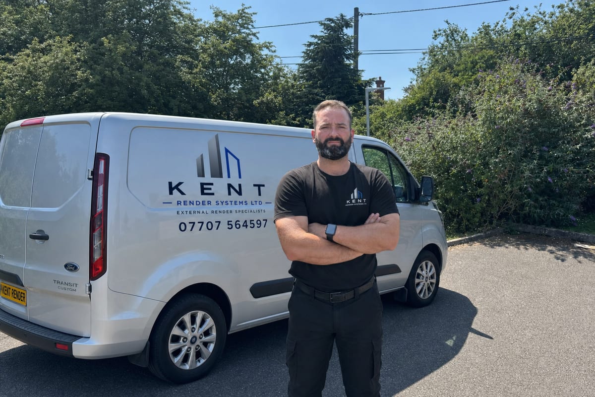 Jack from Kent Render Systems standing in front of the branded company van in Kent